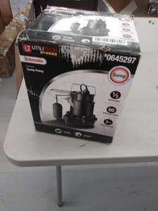 lot 3946 image: Utilitech Pro .33-HP Cast Iron Submersible Sump Pump- USED, RUSTED, NOT INSPECTED OUTSIDE BOX