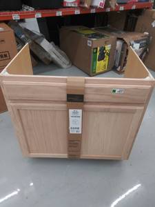 lot 4456 image: Kitchen Classics 35-in x 36-in x 23.75-in Unfinished Oak Sink Base Cabinet- DAMAGED NO BACK
