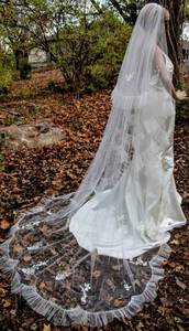 lot 7558 image: 104 Long Cathedral Veil with Hand Stitched Applique Floral Details, Scalloped Train and Ruffled Edging