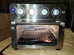 lot 55024 image: Wolfgang Puck 1700-Watt 23-Liter Air FryerOven with Rotisserie Scratch or Dent- Retail$84.49
