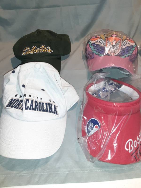 lot 4699 image: Lot of 3 Baseball Caps and 1 Sunvisor, 1 Fitted University of North Carolina, 1 Cabelas Adjustable Back, 1 Snapback with Multicolors and Rhinestones, 1 Boston Terriers Sunvisor
