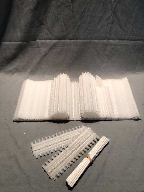 lot 4794 image: Plastic Conveyer Belt with Pieces Location Shelf 4