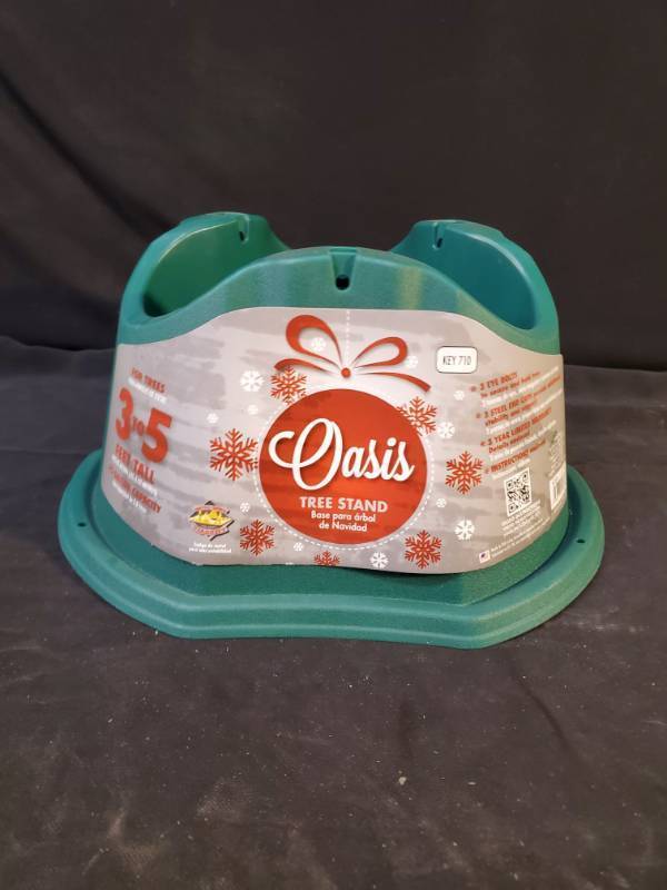 lot 4845 image: Oasis 9708421 5 ft. Plastic Green Christmas Tree Stand