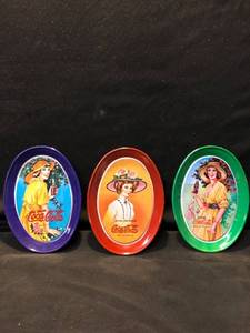 lot 80465 image: Mini Metal Coca-Cola Plates Location Shelf 4