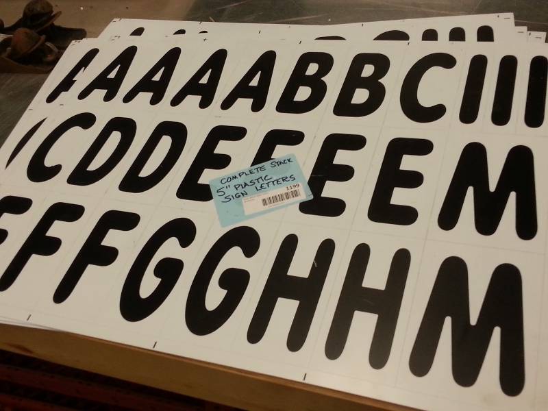 lot 1199 image: A set of outdoor signs 6 tall plastic letters and numbers with other symbols