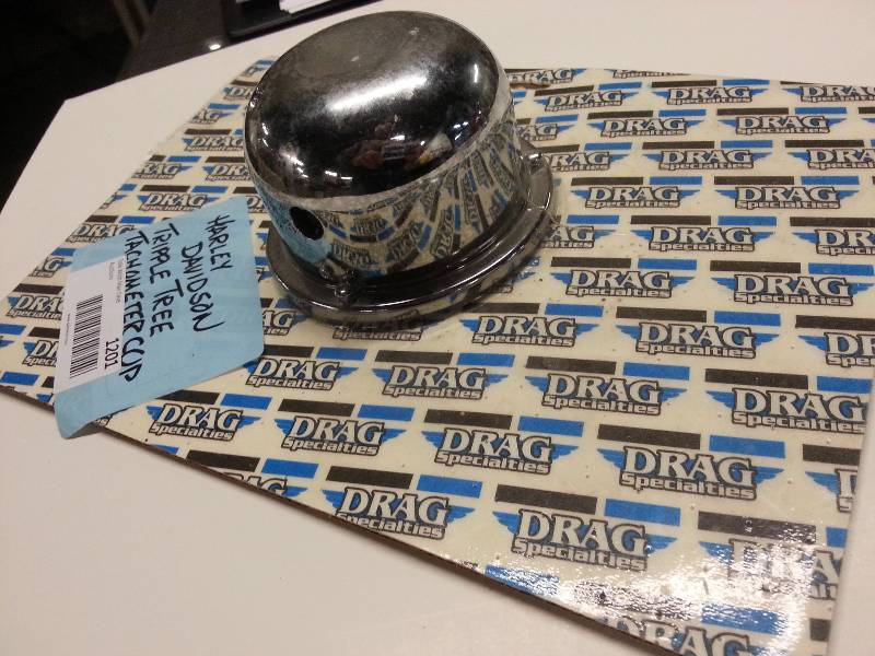 lot 1201 image: New Drag Specialties chrome aluminum tachometer cup designed for Triple Tree on motorcycles