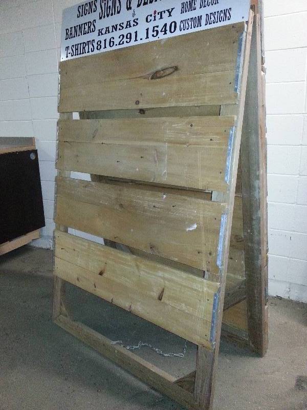 lot 1194 image: 6 feet tall & 48 wide Sign board made of very nice 1X real wood panels that folds up for flat storage