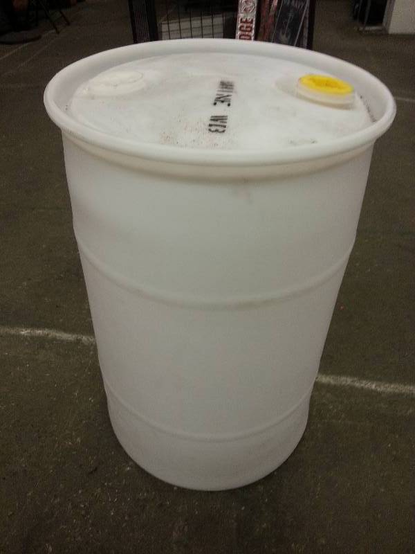 lot 1196 image: Used only once is this 30 gallon HD plastic one piece lid water garden furnace oil barrel