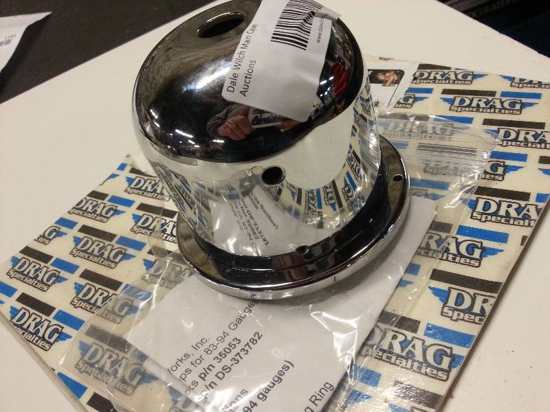 lot 1202 image: New Drag Specialties chrome aluminum speedometer cup designed for Triple Tree on motorcycles