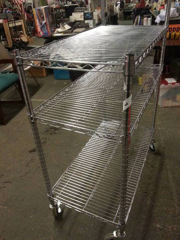 lot 1218 image: Great condition Metro shelving unit with 3 adjustable shelf racks and large diameter casters