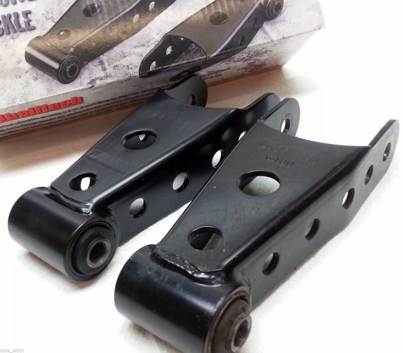 lot 1244 image: Pair of the 2 inch dropped Belltech # 6400 kit Rear Leaf Spring Shackles Black