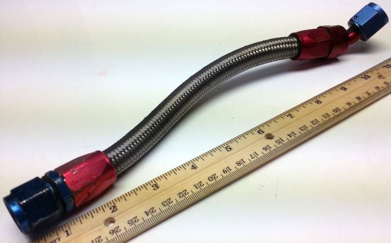 lot 1246 image: Short 12 inch -8AN steel braided hose with the Red and Blue race car aircraft fittings
