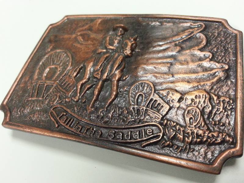 lot 1256 image: Cool looking new Brass looking Tall in the Saddle cowboys belt buckle