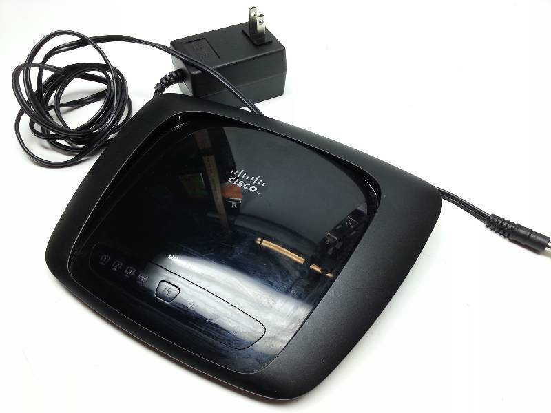 lot 1277 image: Linksys E1000 home or small office wireless router by Cisco.  This was just replaced with all in one modem and no longer needed