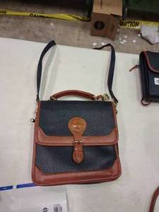 lot 2357 image: Black and Tan Dooney and Bourke Cross Body Purse