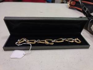 lot 2359 image: 14k 8 31g White and Yellow Gold Textured Oval Ribbon Bracelet