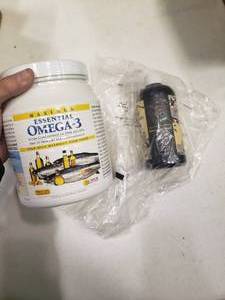 lot 2391 image: Wild Summer Apricot Cleansing Hair Treatment and 720 Essential Omega-3 Capsules