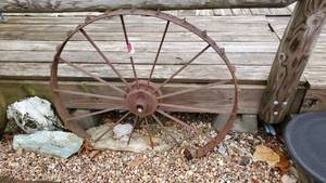lot 3458 image: (2) Wagon Wheels In Concrete