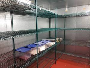lot 9002 image: Green metro shelving in cooler