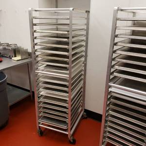 lot 9012 image: Aluminum sheet pan rack with 15 cookie sheets and 3 cutting boards