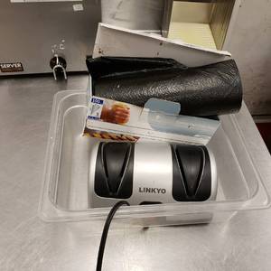 lot 9017 image: knife sharpener and trash bags