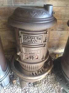 lot 3908 image: Antique Round Oak Wood Burning Stove