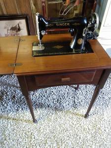 lot 5558 image: singer sewing machine in cabinet