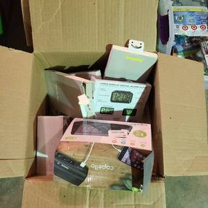 lot 55844 image: Miscellaneous box of electronics- chargers, cell phones cases, alarm clocks and more - as is
