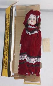 lot 6984 image: Porcelain Head with Cloth Body Doll in Western Dress