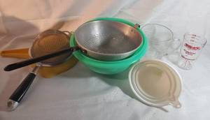 lot 9947 image: Lot of 9 Kitchen Must Needs. Strainers. Measuring Cups and Funnels
