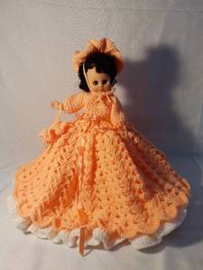 lot 9974 image: Baby Doll with Crocheted Dress and Doll Stand