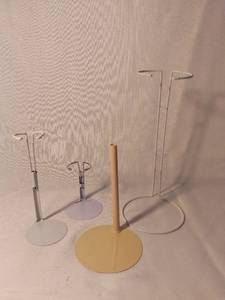 lot 9975 image: Lot of 4 Metal Doll Stands of Various Sizes