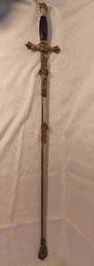 lot 1452 image: Knights of Columbus Ceremonial Sword and Metal Scabbard by Craddock Mercantile Company Kansas City Missouri the name Fredrick R. Johnson Etched on the Blade