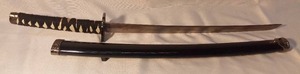 lot 1457 image: Practical XL Jappense Katana with White Leather Handle and Black Wooden Scarbbard