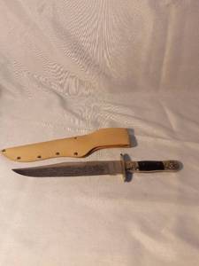 lot 1473 image: Stainless Steel Made in Pakistan Ole Smokey Etched Blade with Self Defender Inscribed with Leather Sheath