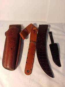 lot 1493 image: Lot of 4 Leather Sheaths and Gun Holder