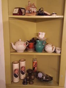lot 6271 image: Contents of three shelves. teapot, brass, candles, clocks and more
