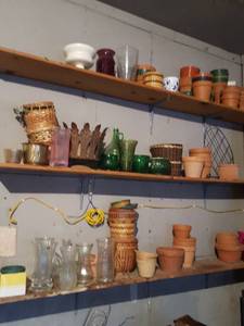 lot 6331 image: Contents of three shelves, terracotta pots, baskets and vases