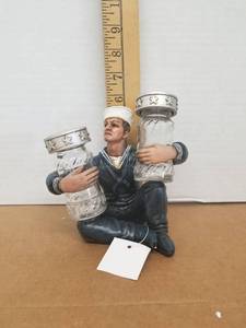 lot 77 image: Navy Salior Holding The Salt And Peper Shaker Holder