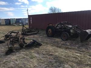 lot 200 image: 8N Ford tractor with bucket, brush hog, sod bucket, disc, plow and 2 extra wheels