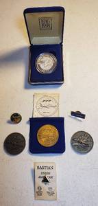lot 114 image: Boeing MAKING HISTORY EVERY DAY 75 Years One Troy Ounce .999 Fine Silver wpresentation case, 3 Brass Boeing Tokens, and 3 BoeingUnion Pins