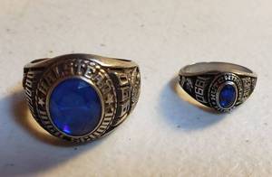 lot 135 image: 2 Class Rings (1990) by Jostens  made out of Luster Metal  Small Ladies Hutchinson & Medium Mens Halstead