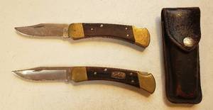 lot 143 image: 2 Buck 110 USA Pocketknives  50th Anniversary Lockback Pocket Knife (Blade tip reworked) And Sheath
