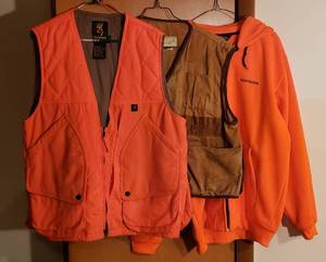 lot 171 image: Hunting Vests and Jacket  Browning Orange vest (MM), American Field Tan Vest (Lg.)and Winchester Orange Jacket (Lg.)