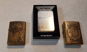 lot 200 image: 3 Vintage Zippo Lighters  2 Solid Brass Lion & Indian and 1941 Replica (made in 2009)