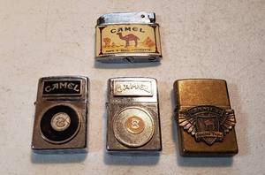 lot 204 image: 4 Vintage Camel Advertising Lighters  3 Zippo and Penguin