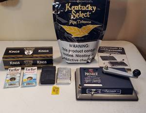 lot 210 image: Cigarette Making Products  Premier Supermatic, Half Bag of Tobacco, 2 Boxes of Tar Bar, Box ox Cigarette Filter Tubes and Cases