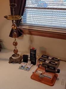 lot 211 image: Cigarette Making Products  Cigarette Making Machine, 2 Boxes of Tar Bar, Box ox Cigarette Filter Tubes, Cases, Lighter Fluid and Ash Tray (27 in. tall)