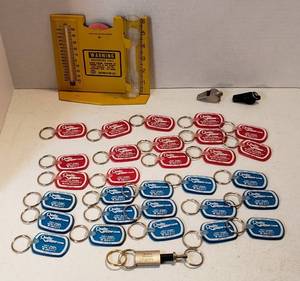 lot 214 image: Southwestern Bell Weather Gauge, 2 Acme Whistles, Numerous Quality Chevrolet Keychains and Boeing Keychain