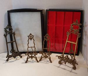 lot 221 image: 4 Cast Brass Easels (10.5 to 16 in. tall) and 2 Flat Display Cases (12 x 16.5 in. x 1 in. deep)